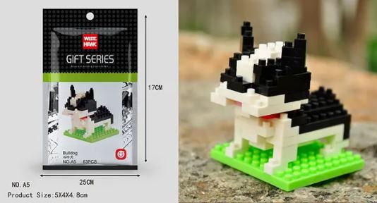 A small black and white bulldog model sits on a green base, built from Mini Nano Micro Diamond Animal Building Blocks. The Wise Hawk Gift Series packaging displays an illustration of the bulldog, sized at 5x4x4.8 cm, designed to enhance fine motor skills with intricate details.