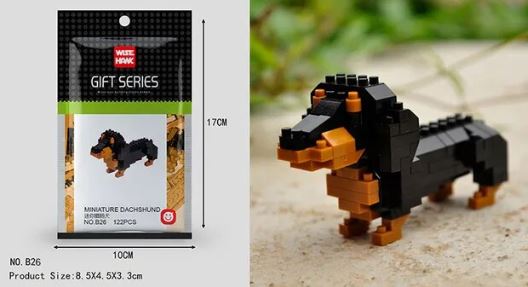 The Mini Nano Micro Diamond Animal Building Blocks set includes black and brown bricks to construct a miniature dachshund. The package size is 17x10 cm, featuring interlocking blocks that form a model measuring 8.5x4.5x3.3 cm on a stone-like base.