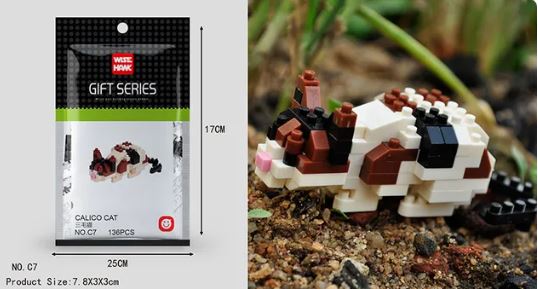 The Gift Series by Wise Hawk features Mini Nano Micro Diamond Animal Building Blocks for a calico cat model. The packaging includes a set to build a block-based calico cat measuring 7.8X3X3cm, placed on a natural outdoor surface.