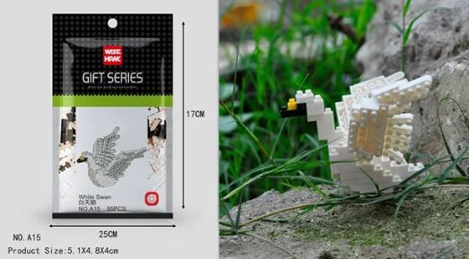 The packaging of a Wise Hawk Mini Nano Micro Diamond Animal Building Blocks White Swan set, measuring 25cm by 17cm, is on the left. On the right, a completed white swan model sits elegantly on a rock outdoors.