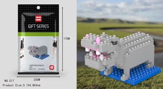 The Mini Nano Micro Diamond Animal Building Blocks set includes a charming gray hippopotamus with pink details on a blue base against a natural backdrop. This Wisehawk model stands 17cm tall and 25cm wide, part of the educational Wise Hawk Gift Series.