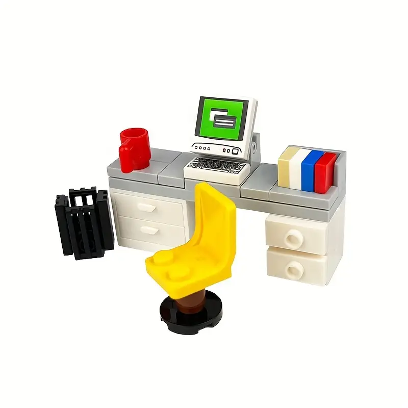 The colorful setup features Minifigure Computer Desk Furniture with a green screen computer, red mug, yellow chair, black crate, block-formed drawers, and a stack of red, blue, and yellow books. This vibrant scene combines building blocks into a modern home decor accessory.