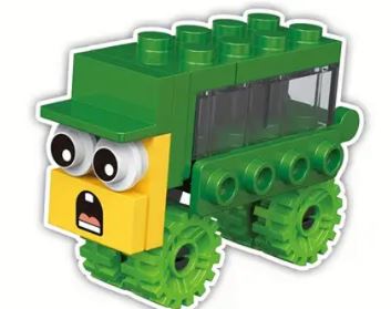 This green and yellow cartoon truck or tractor, part of the Cartoon Brick Block cars collection with 12 options, features interlocking bricks, large expressive eyes, a surprised mouth, and four textured wheels.