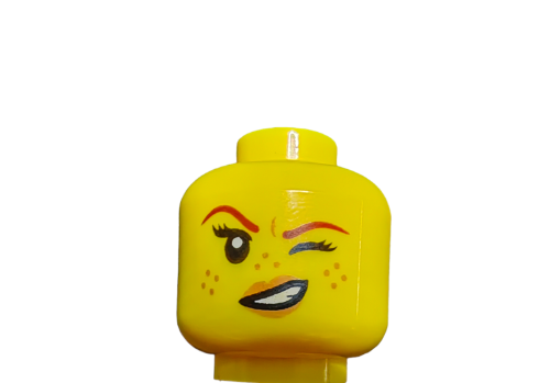 The LEGO 6223923 Minifigure Head, Double Faced Spotty with a Cheeky Smirk and Wink - UB1017, is a yellow head featuring red eyebrows, one eye closed in a wink, freckles, and a cheeky smirk revealing white teeth—perfect for adding fun and mischief to any creative build.
