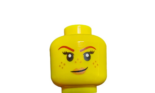 Close-up of a LEGO 6223923 Minifigure Head, Double Faced Spotty with a Cheeky Smirk and Wink against a plain white background, featuring bold eyebrows and freckles.