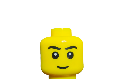 Close-up of the LEGO 4651441 Minifigure Head, Angry Face With Black Eyebrows - UB1005, featuring sharp eyebrows and a frowning expression against a white background.