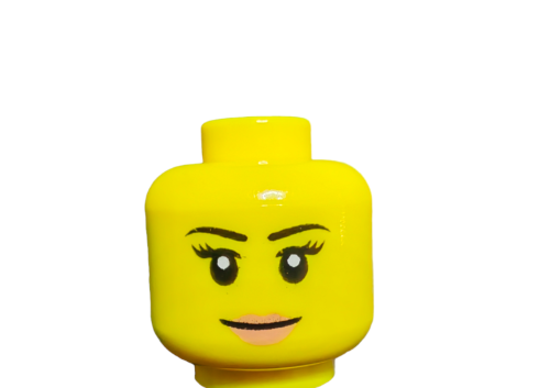 Close-up of the LEGO 6100203 Minifigure Head with a joyful expression, featuring large eyes highlighted by black eyebrows and eyeliner, and pink lipstick. The playful face stands out against the plain white background.