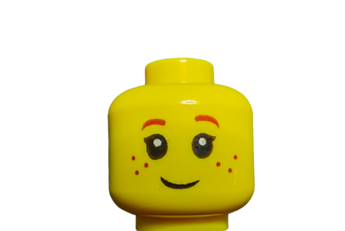 Close-up of LEGO 6105708 Minifigure Head, featuring a smiling face with large eyes, eyelashes, dark red eyebrows, and freckles. Ideal for any minifigure enthusiast against a plain white background.