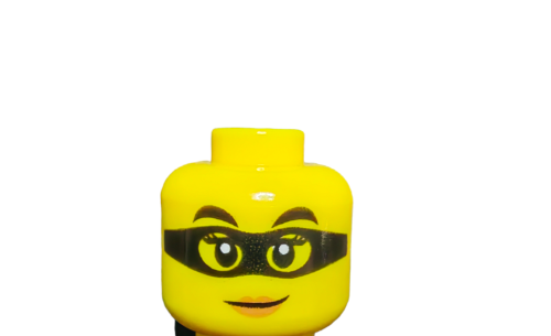 Close-up of LEGO 6288016 Minifigure Head, featuring two-sided face with large eyes, black eyebrows, and a playful smile under a black mask. Set against a plain white background.