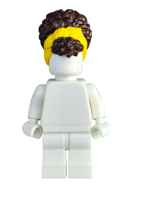 A LEGO figure with a white body and the LEGO 6361359 Wig, Brown Hair Pulled Up with Yellow Head Wrap is an ideal addition to any miniature character collection.