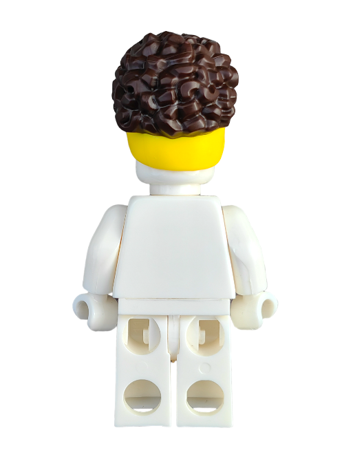 The LEGO minifigure features a rear view with curly brown hair, styled by the LEGO 6361359 Wig, Brown Hair Pulled Up with Yellow Head Wrap - UB1293. It wears a plain white outfit against a white backdrop, perfect for enhancing your miniature character collection.