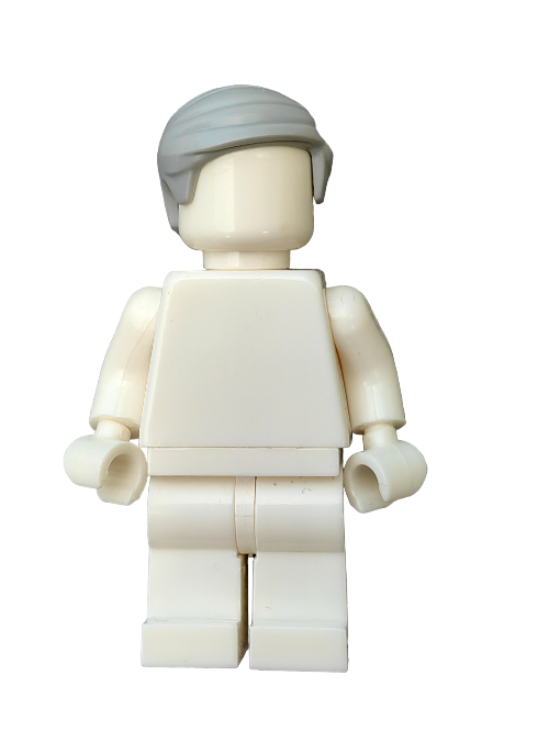 A white LEGO minifigure, featuring the LEGO 6310479 Wig with grey hair short combed to the side (UB1319), stands against a plain white background. Faceless and without prints, it adds subtle charm to any Minifigure collection, with arms calmly by its sides.