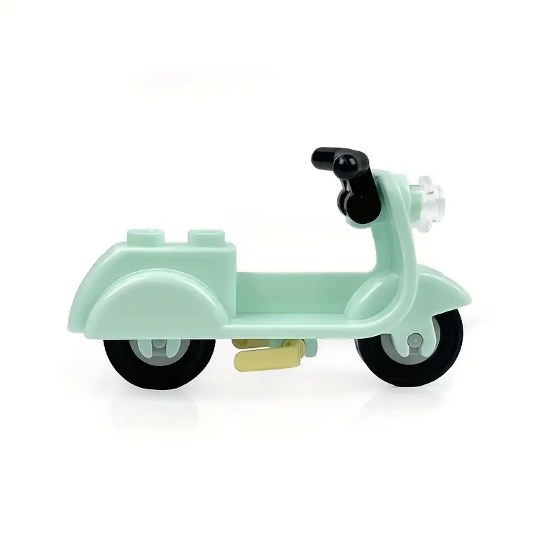 The Minifigure Mopeds light blue toy scooter, crafted from interlocking plastic bricks, features black wheels and a handlebar. Its ideal for adventure seekers and shines beautifully against a plain white backdrop.