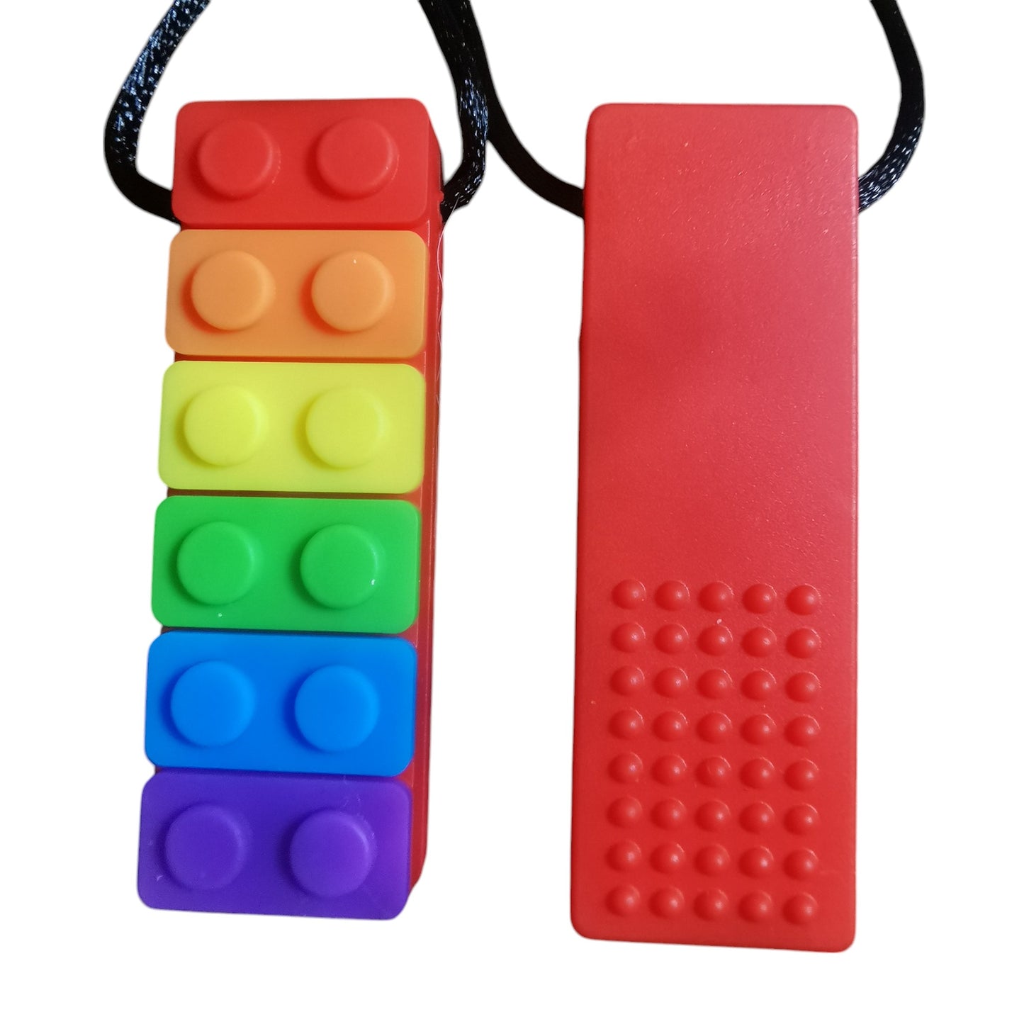 Two Sensory Chew Necklaces: The left is a Rainbow Chew Necklace with vibrant stacked blocks and textured bumps, while the right is solid red with a bumpy texture. Both hang on black cords and serve as sensory aids for children with ADHD or teething, made of food-grade safety silicone.