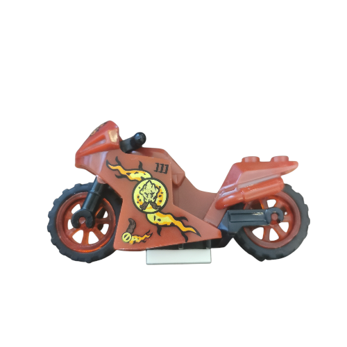 The Minifigure Bikes for Racing is a sleek toy motorcycle, made from interlocking bricks in vibrant orange and black with a flame and skull motif. It has orange wheels, an integrated seat, and a rear light, perfect for intense races.