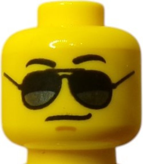 The LEGO 6112622 Minifigure Head features black sunglasses and a smirk, adding a cool, calm demeanor typical of iconic Lego figures.