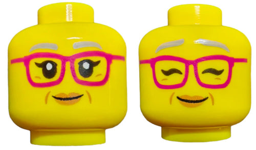 Two LEGO 6305730 Minifigure Heads boast pink glasses and smiles. One has open eyes with eyelashes, while the other winks playfully. Both feature silver eyebrows and a small mustache, highlighting their distinctive Double Face allure.
