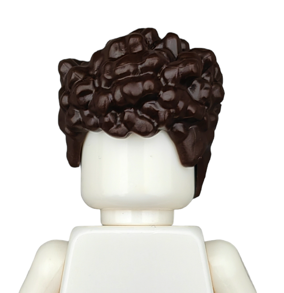 A Lego figure from the back showcases detailed textured curly brown hair, named BROWN WIGS. The figure has a white head and upper torso against a plain white background.