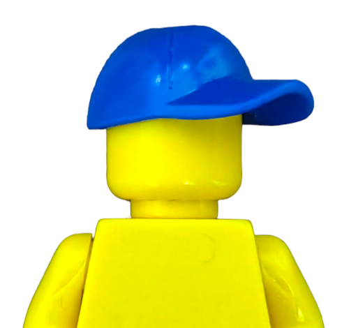 Close-up of a yellow minifigure in a LEGO 6032176 BRIGHT BLUE CAP - UB1368. The figure faces away, showcasing its smooth, faceless head. Its vibrant yellow contrasts with the plain backdrop, and the cap adds a playful touch.