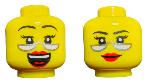 The yellow LEGO 6384569 minifigure features dual-sided heads: one with a smiling face, glasses, raised eyebrows, and an open mouth; the other with a female expression sporting a smirk, silver glasses, arched eyebrows, and red lips. Both share charming designs.