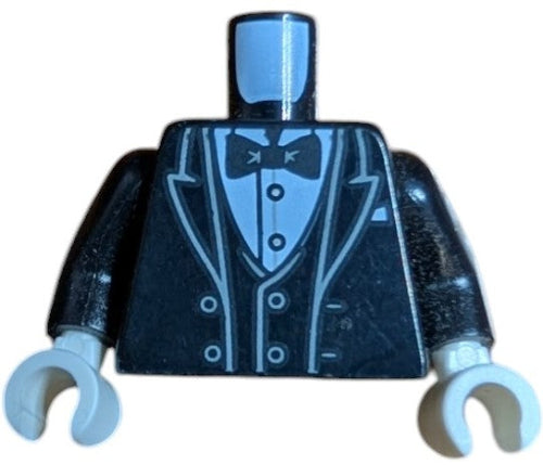 The LEGO 6438667 features a stylish tuxedo jacket with open dark bluish gray outlined lapels, vest, white shirt with silver buttons, bow tie, and pocket square pattern. The piece includes black arms with white hands but is missing its head. Perfect for any formal-themed setting.