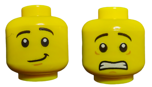 Two yellow LEGO 6182787 Minifigure Heads present dual expressions: one smirking with raised eyebrows and the other worried with wide eyes and a gritted mouth.