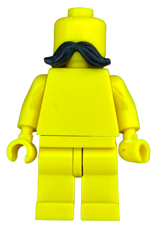 The LEGO 6269933 Moustache features a yellow head with a bold black mustache, presented without additional facial features, hair, or accessories against a plain white background.