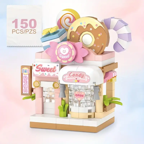 The Building Blocks Sweet Shop / Candy Store set includes 150 pieces to construct a white and pink shop, featuring a large donut, candy swirls, and the word Candy. An inviting Open sign greets customers in the window.