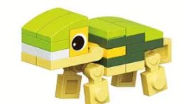A toy turtle from the 12 Brick Block Forest Animals set comes in green, yellow, and white blocks. It has a cartoonish eye, blocky legs, and a small tail—ideal for playtime with other forest creatures like the lion or squirrel.