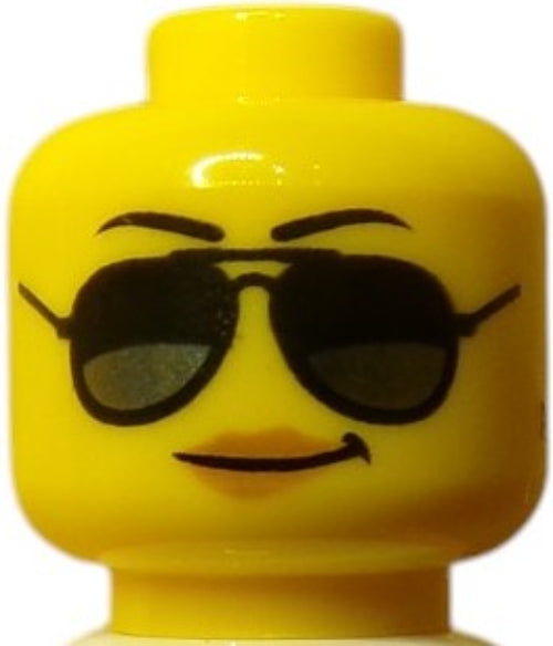 The LEGO 6176636 Minifigure Head, in yellow, features a customizable design with a smirking expression, black sunglasses, and slightly raised eyebrows.