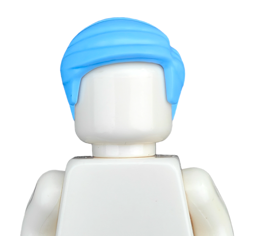 A COLOURED WIGS toy figure, made of white plastic with blue hair, resembles a classic building block figure, set against a white background. The face is blank and features no intricate details or clothing.