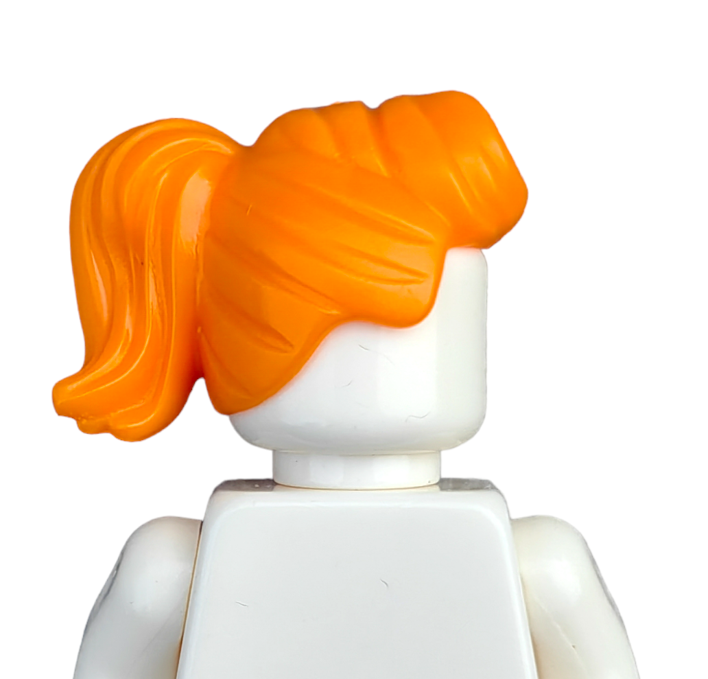 A close-up of a COLOURED WIGS Lego figure features an orange ponytail hairstyle and a plain white torso, all set against a white background.