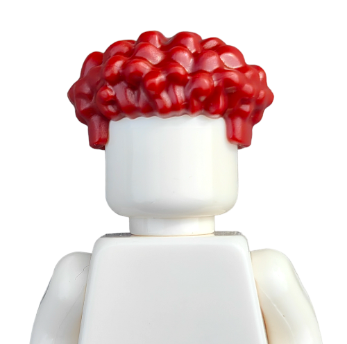 The COLOURED WIGS Lego minifigure has a plain white body and sports a head with bright red, curly hair, set against a plain white background.