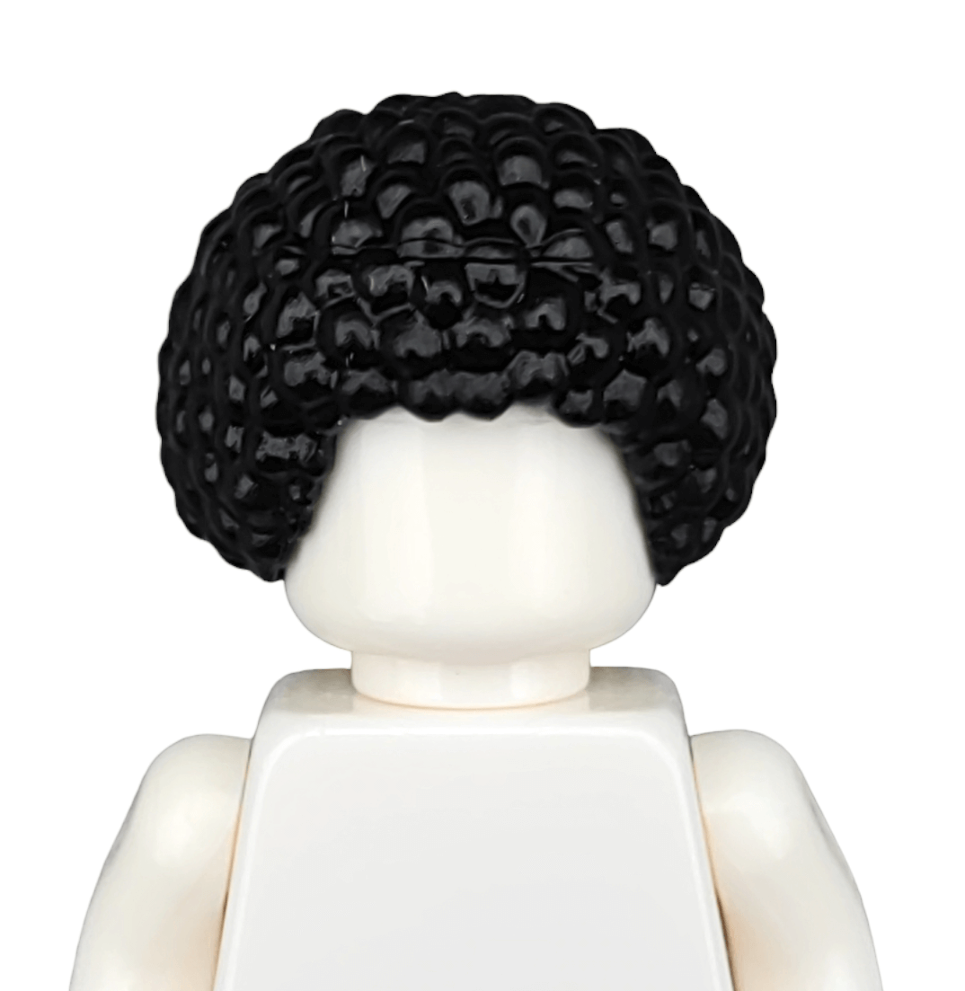 A close-up of a Lego minifigures head and shoulders, featuring a black textured afro-like hairpiece (BLACK WIGS). The facial details are obscured, and it wears a plain white torso.