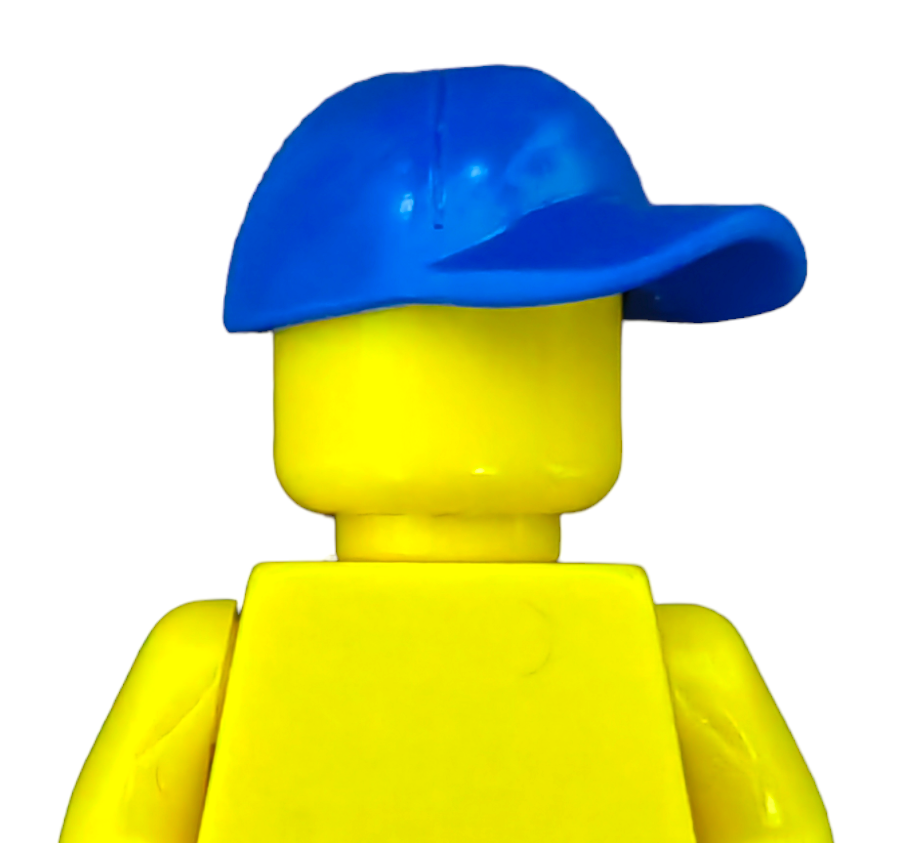 The yellow Lego figure is seen from the back wearing a blue cap, with no visible facial features, emphasizing the simple design characteristic of Lego figures. The plain white background underscores its simplicity. Named PRODUCT HATS AND HOODIES, this piece highlights classic Lego style.