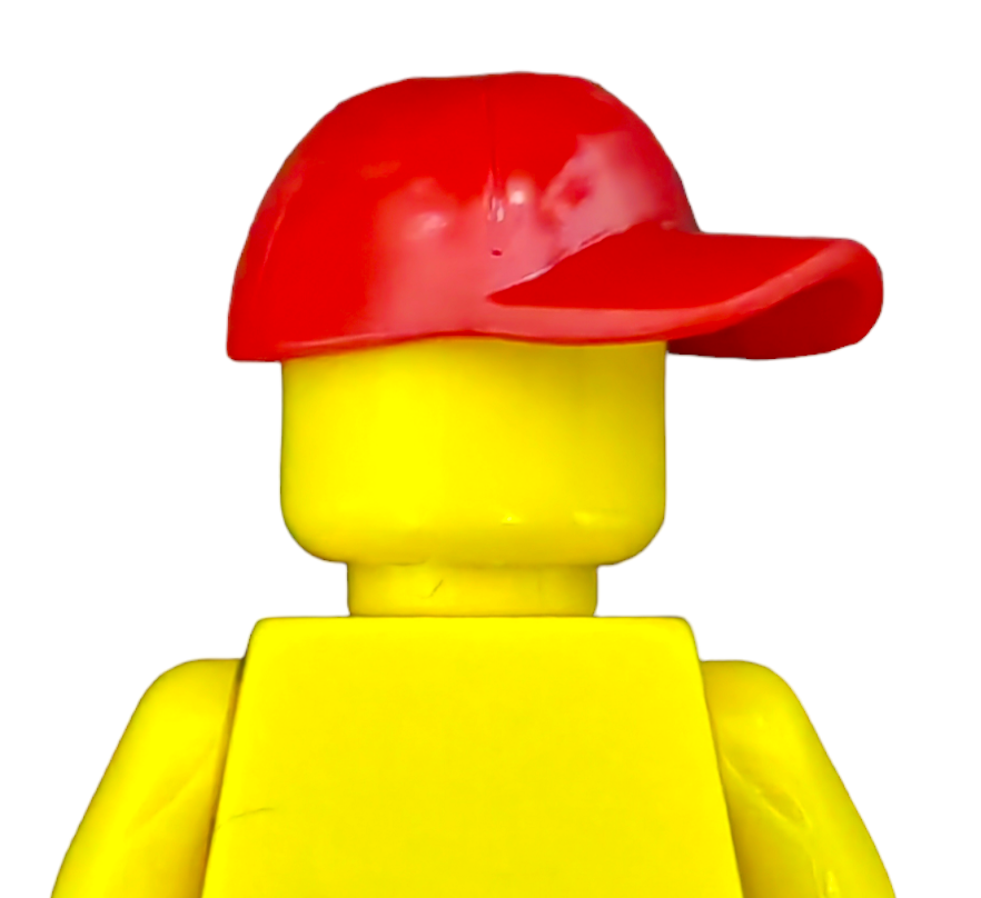 A vibrant yellow Lego figure wearing a bright red baseball cap, facing away from the viewer, embodies the classic minifigure design typical of PRODUCT HATS AND HOODIES.