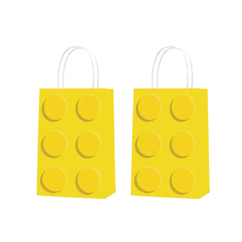 The Brick Block Party Bags Pack of 12 mimics toy building bricks with playful yellow designs and circular patterns, ideal for LEGO fans. Featuring white handles, theyre perfect as party favors and are set against a plain white background.