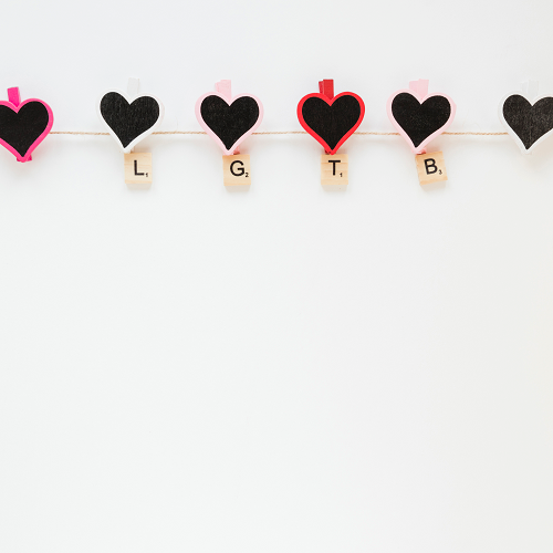 The LOVE BACKGROUNDS string features black heart clips with letters beneath reading L, G, T, and B. Some hearts have pink or red outlines on a white backdrop.