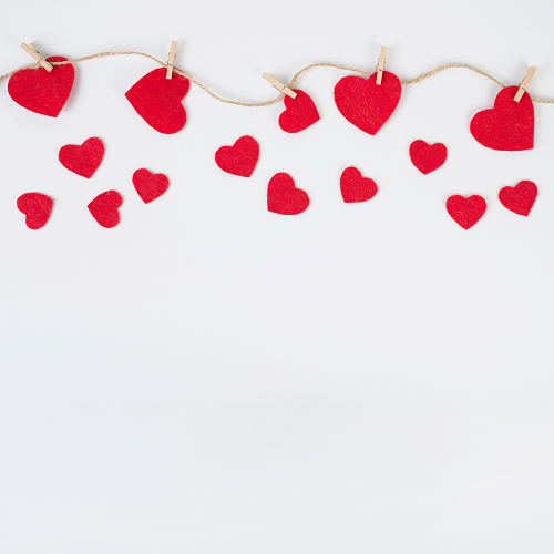 The LOVE BACKGROUNDS features red felt hearts attached to twine with wooden clothespins, scattered on a white backdrop, creating a charming and romantic atmosphere.